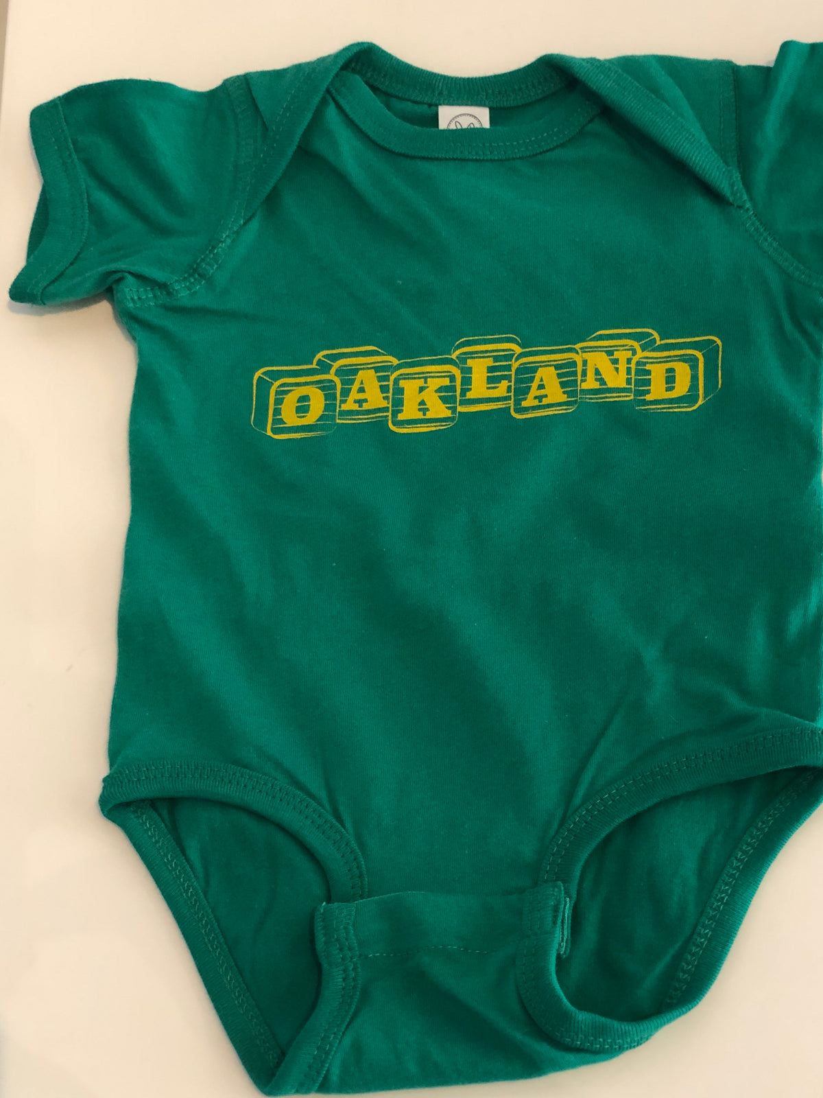 Oakland Green Onesie
