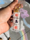 Sakura Tin Tin Clicker Keychain