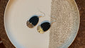 Dangle earrings: black with silver charm