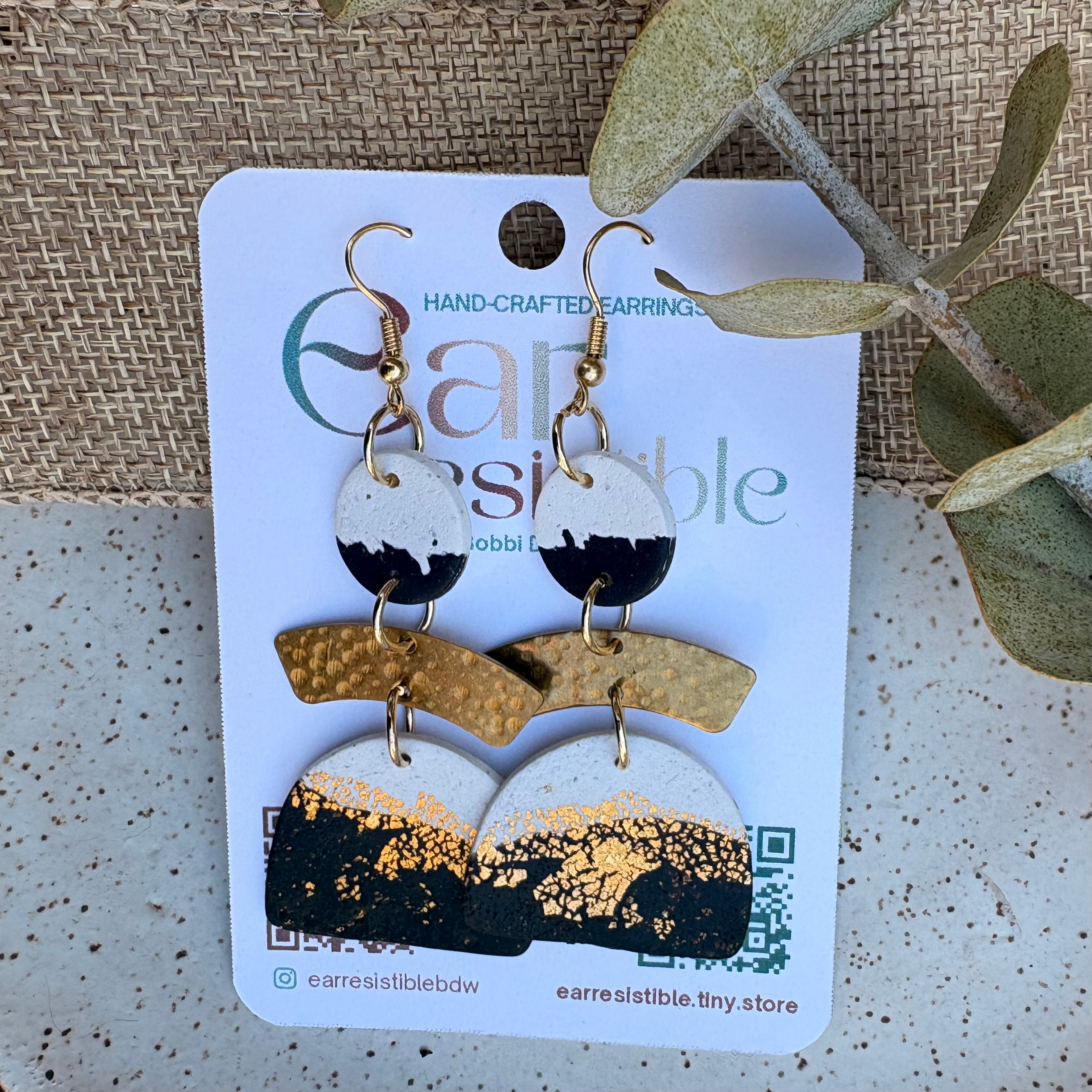 Dangle earrings: navy and cream with gold charm