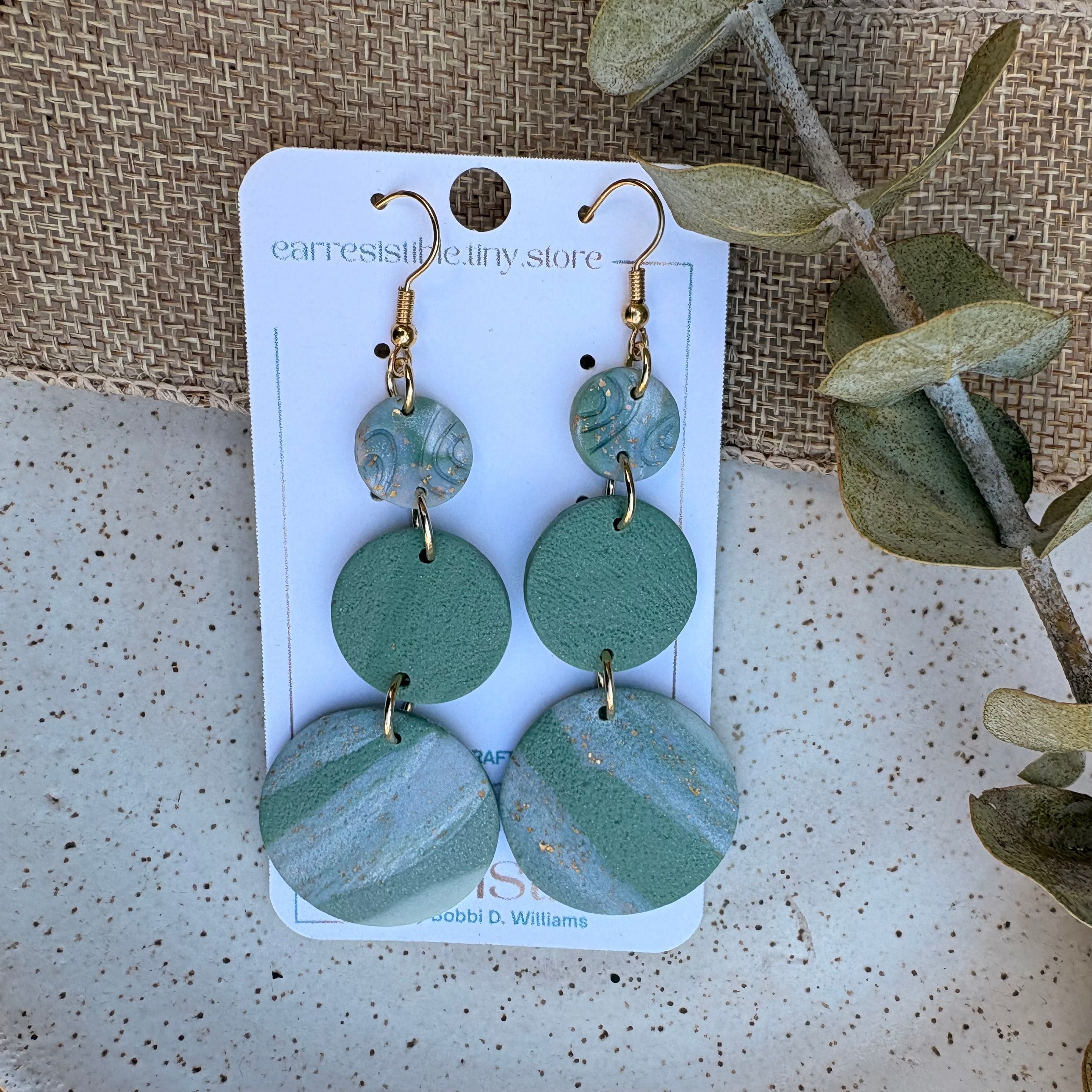 Dangle earrings: Sage green with gold.